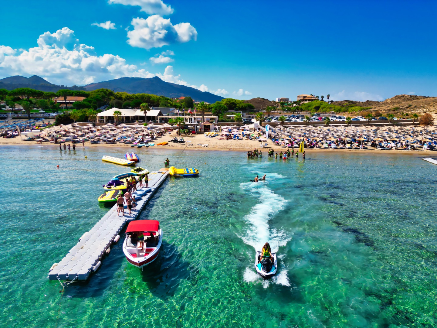 Agios Nikolaos Beach with loads of water sports activities and turquoise waters